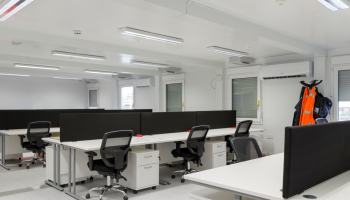 Inside an accommodation unit - new desks and chairs setup